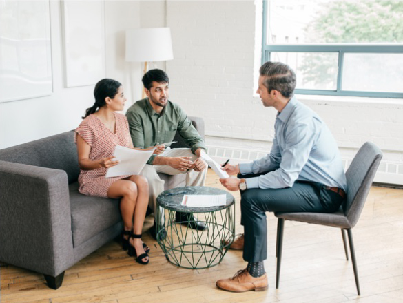 Couple working with a businessman