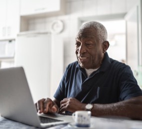 Mature man working on a computer
