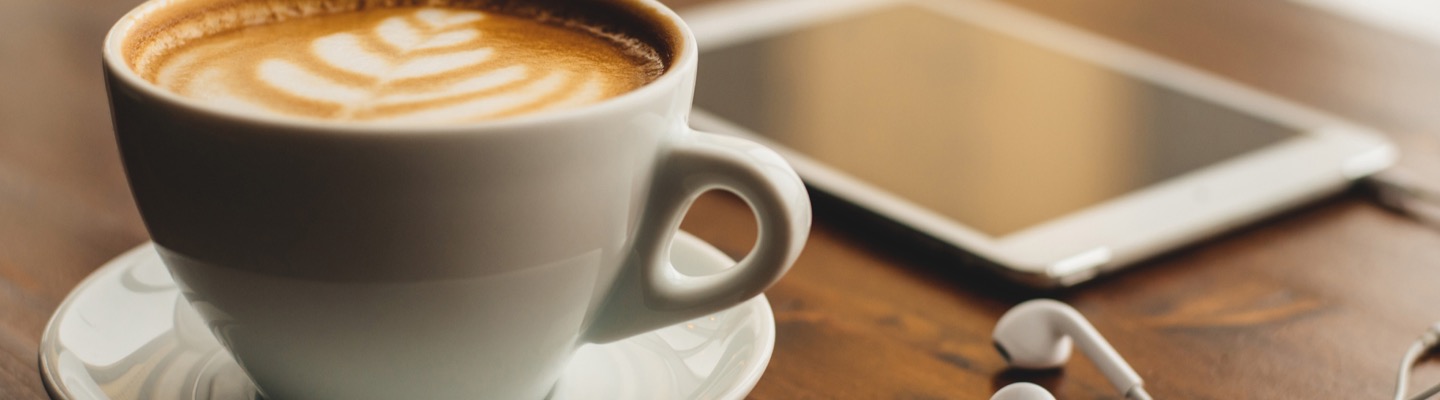 Coffee and mobile phone on desk