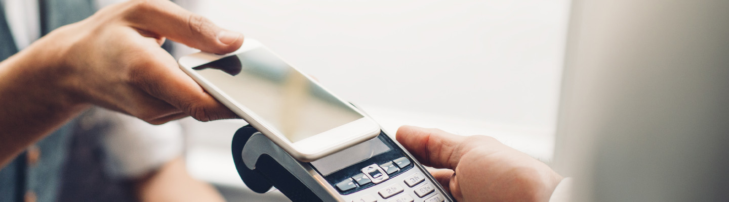 man using phone to pay